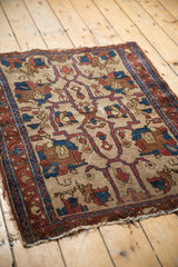 Aged fringe and border of an antique Persian Lilihan rug with indigo, chestnut, and ivory palmettes.