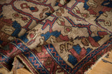 Hand-knotted pile texture on ivory Lilihan rug, with indigo blue and chestnut vinery patterns.