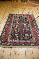 Original fully intact macramé ends, deep red and ivory geometric border of an antique Kuba rug.
