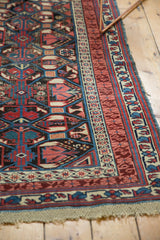 Antique Caucasian Kuba rug corner detail, showcasing original macrame ends and geometric patterns.