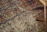 Antique Malayer rug detail: hard wear on beige field, revealing foundation, red and indigo vinery.