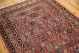Mostly even wear across the knot heads of this antique Malayer runner's Herati motif.