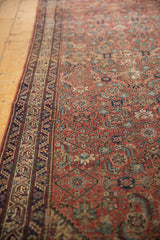 A long perspective view showing the rhythmic Herati motif and detailed border of an antique Malayer.