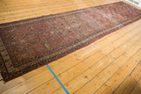 Angled view of an antique Malayer runner showcasing the rhythm of its Herati pattern.
