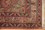 The fine, low pile and elaborate border system of an antique Persian Malayer rug corner.