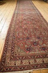 Angled perspective view of the full length of an antique Persian Malayer runner.