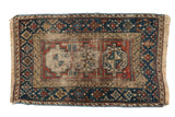 Antique Beshir rug with triple gul medallions, geometric border in navy, madder red, beige.