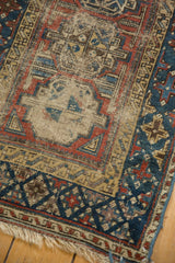 Antique Turkmen Beshir rug close-up, geometric gul motifs, navy, madder red, beige, and foundation etching.