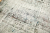 Distressed Sarouk carpet texture showing knot heads and etched foundation, charcoal and purple.