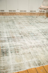 Worn texture of distressed Sarouk rug, visible foundation, knot heads, and fringe.