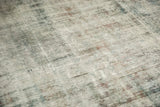 Distressed texture with exposed knot heads and foundation on the vintage Sarouk rug.