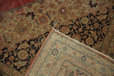 Hand-knotted back and distressed pile of a vintage Tabriz carpet with new side selvage.