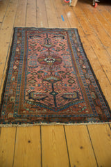 Short white fringe and intricate floral design on the Lilihan rug runner's low pile.