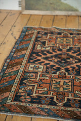 Antique Karaja rug's low pile, geometric starbursts, and polychromatic side cord selvage.