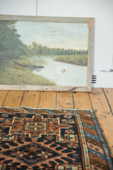 Antique Karaja rug: geometric hook and latch medallion, indigo, terra cotta, ivory.