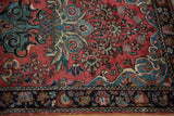 Vintage Mohajeran Sarouk rug with dusty rose field, intricate blue floral motifs, and ornate palmette border.