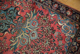 Vintage Persian Mohajeran Sarouk rug's dusty rose field, navy border, blue floral palmettes.