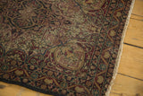 Persian Kerman antique rug border, cochineal, navy, ivory floral patterns, mostly even wear, worn fringe.