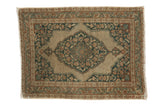 Antique Persian Jalili Tabriz rug with ivory, navy, and rust floral medallion.