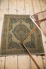 Intricate design of antique Persian Jalili Tabriz rug with scalloped medallion, ivory, navy, and rust.