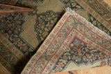 Detail of the antique Tabriz rug's fresh fringe and tight hand-knotted back.