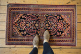 Vintage Lilihan runner, allover floral motif in dark navy, raspberry, sky blue, low pile.