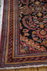 Vintage Lilihan rug corner, low pile, multi-band border with raspberry, sky blue floral motifs.