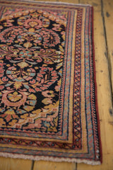 Vintage Lilihan rug corner showing low pile, ivory fringe, and patterned border.