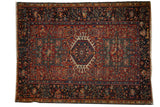 Vintage Karaja rug, central hook and latch medallion, intricate red field, navy borders.