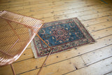 Vintage Tabriz rug's central trefoil medallion with sky blue, blush, and navy details.