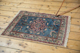 Vintage Tabriz rug with trefoil medallion, sky blue, blush, navy floral patterns.