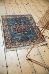 Vintage Tabriz hand knotted rug bottom corner, with ivory fringe and blush floral border.