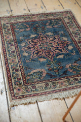 Soft ivory fringe and worn floral border of a vintage Tabriz rug.