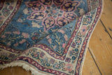 Folded vintage Persian Tabriz rug corner, intricate blush, ivory, cochineal red border, fine fringe.