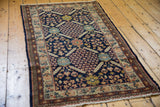 Vintage Pakistani Lahore rug's navy lattice with tree of life and thousand flower motifs.