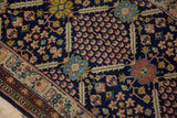Vintage Lahore rug detail: navy blue field showcasing lattice and tree of life motifs.