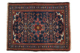 Borchalou Persian rug with navy Herati field, central blush medallion, and rich red borders, 2x2.7 ft.