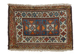 Antique Kurdish rug mat with geometric double medallion, sky blue, ivory, orange, and wine red tones.