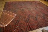 Vintage Ersari carpet: repeating triple gul motifs in madder root brick red and navy blue.