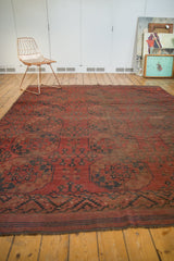 Geometric deep madder root brick red border and secured kilim end of vintage Ersari rug.