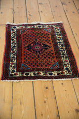 High-angle view of a vintage Engelas rug displaying its intricate boteh pattern and diamond medallion.