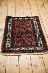 Vintage Persian Engelas rug showing the floral design and reciprocating wave motif in the border.