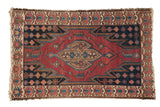 Vintage Malayer rug, cherry red field, dark blue serrated medallion, floral border, worn pile.