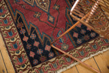 Malayer rug border: cherry red, sky blue, beige germinating floral design, overcast stitching.