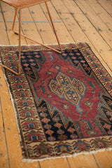Malayer rug's germinating floral main border and jagged field with tattered end.