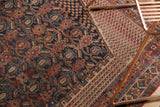 Antique Afshar rug's intricate boteh and vine field transitioning to a geometric border.