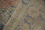 Evenly worn pile texture of a distressed Oushak carpet, blush, beige, and blue patterns.