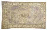 Distressed vintage Oushak carpet, faded purple medallion, antique ivory, slate blue vinery.
