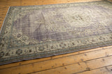 Detail of secured end and distressed purple, antique ivory floral Oushak border.