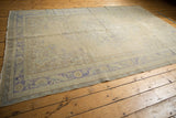 Vintage Distressed Oushak border, faded royal blue serrated leaves, pale coffee brown accents, soft wear.